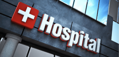 Front of a building that says "hospital" on it