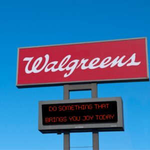Walgreens billboard with white text on red background.
