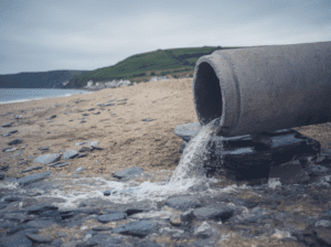 A sewage pipe on the beach. 