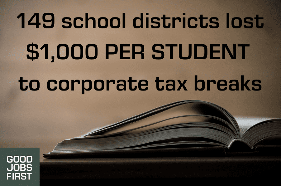 Image of an open book with "Good Jobs First" logo and the text "149 school districts lost $1,000 per student to corporate tax breaks"